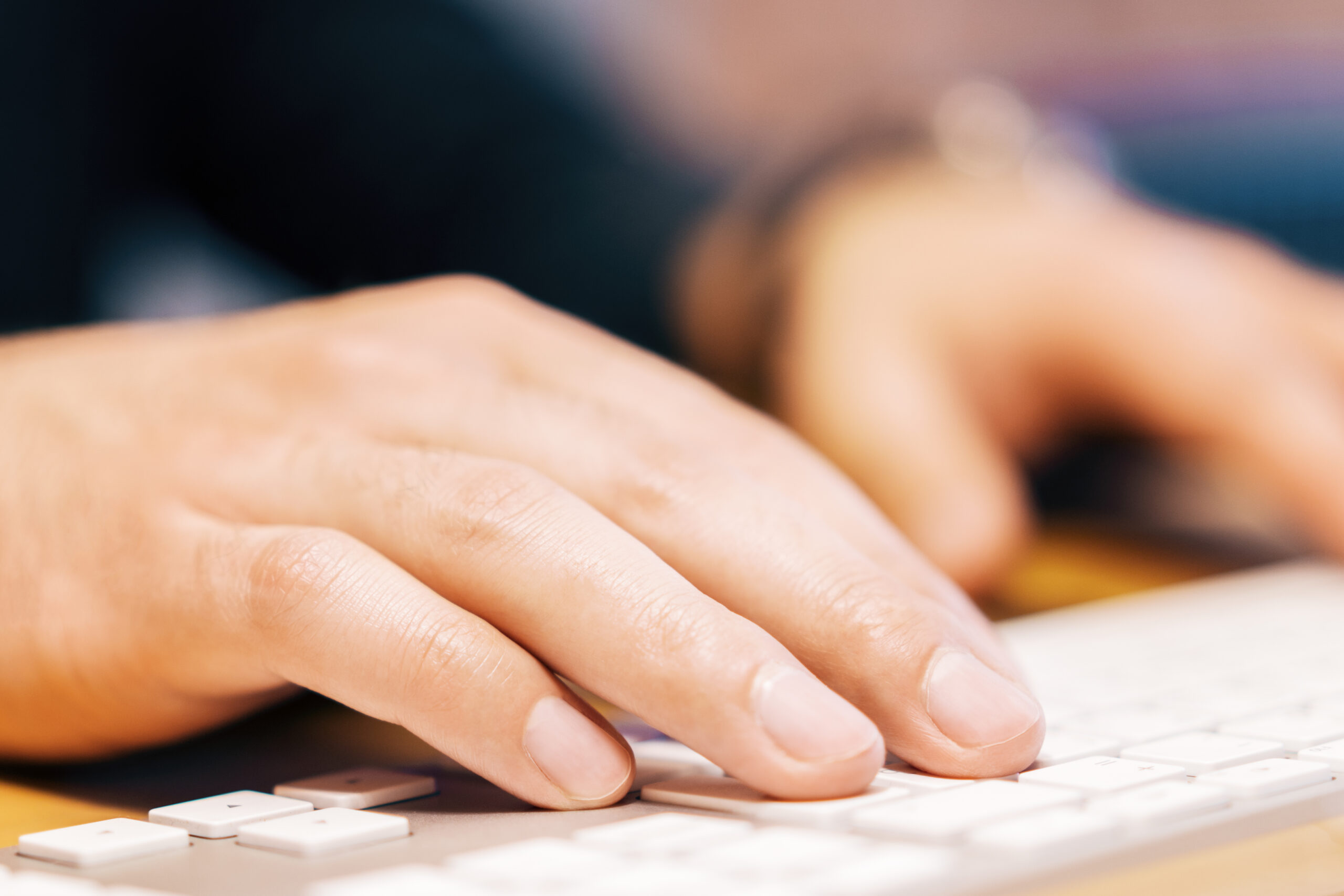 Closeup of businessman hands using keyboard